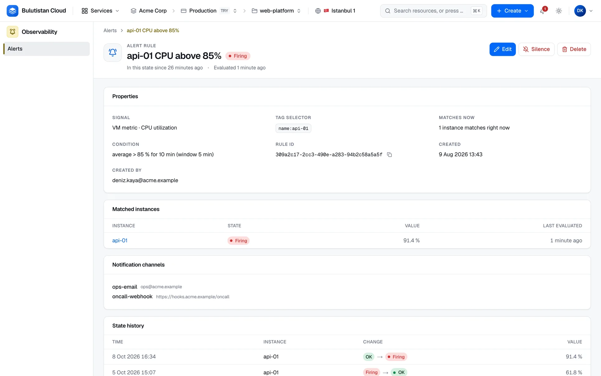 An alert rule's page: a VM metric rule on CPU utilization in the Firing state, its tag selector, the instance it matches with its current value, its two notification channels, and the start of its state history.
